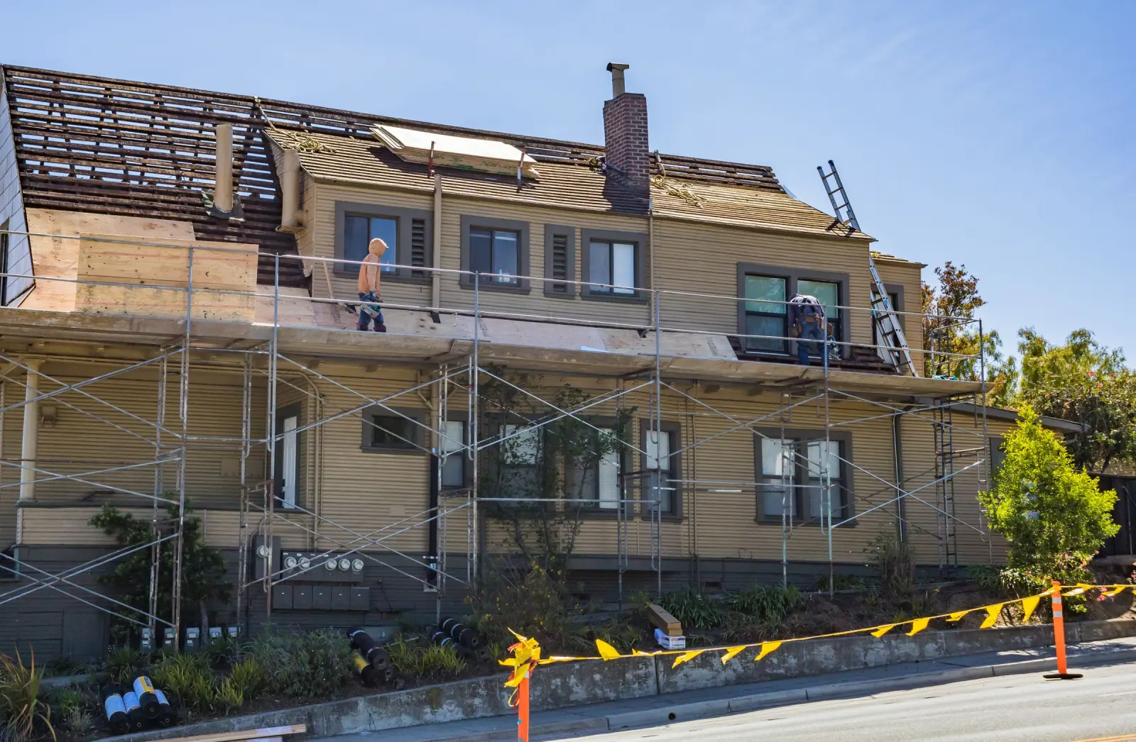 House exterior with scaffolding set up for access during renovation work